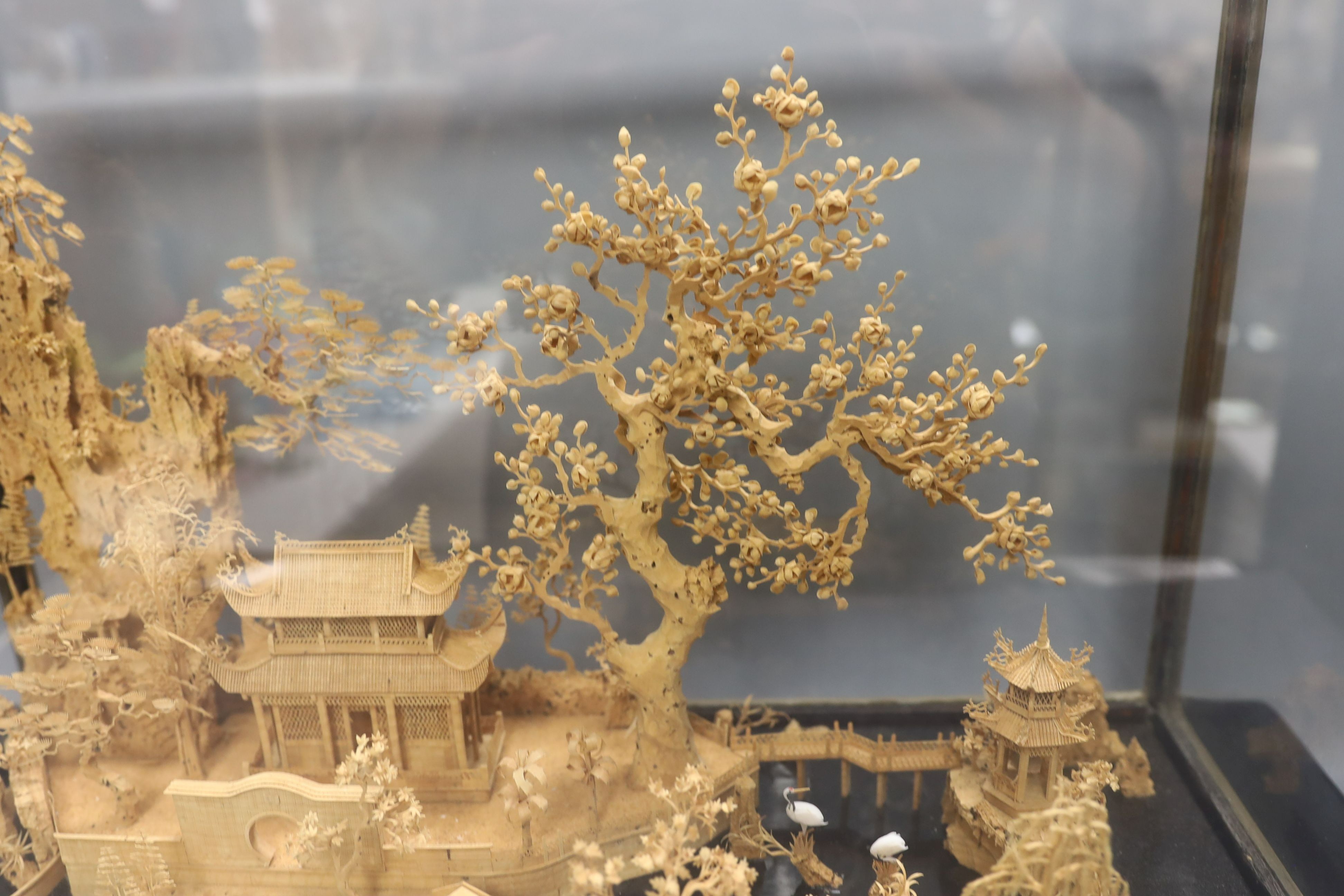A large Chinese export Ruanmu Hua carved cork diorama, depicting a pagoda on stand - 35.5cm tall including case